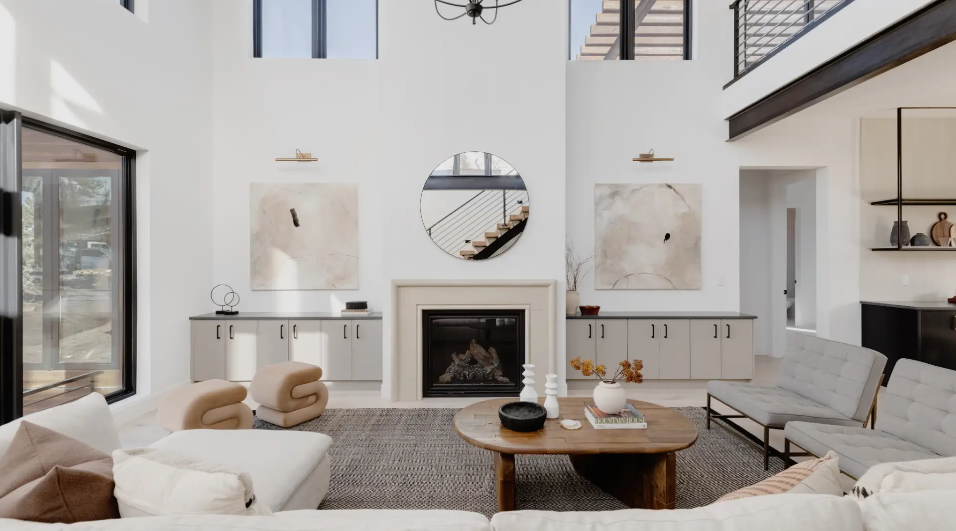Bright and airy living room in a new home with volume ceilings, custom built-ins and luxury finishes. 