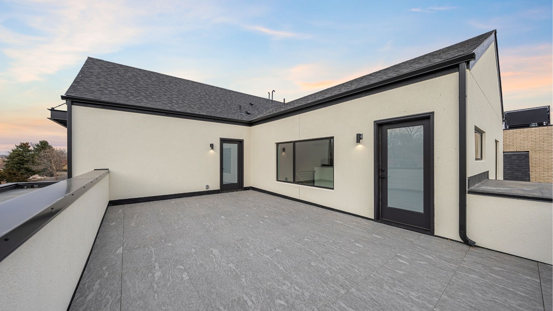 Private rooftop deck with modern stucco exterior in Applewood West Golden home