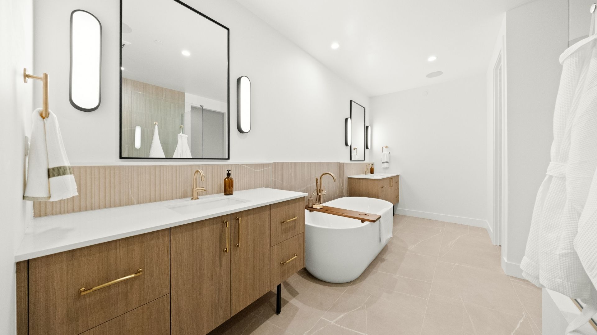 Five-piece junior suite bath with soaking tub and designer finishes in Castle Rock home