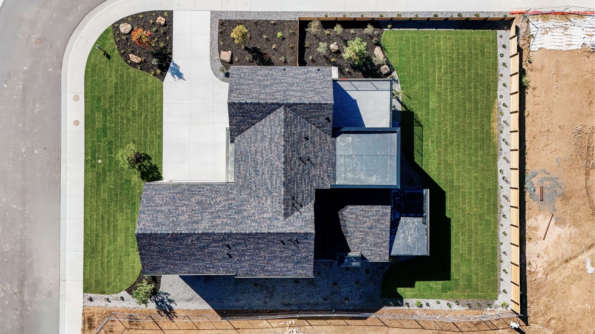 Aerial view of contemporary luxury home on corner lot in Arcadian West Golden Colorado