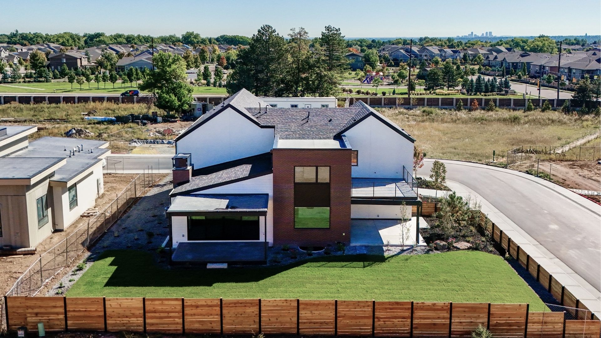 Rear exterior with rooftop deck and private backyard in luxury Golden Colorado new construction