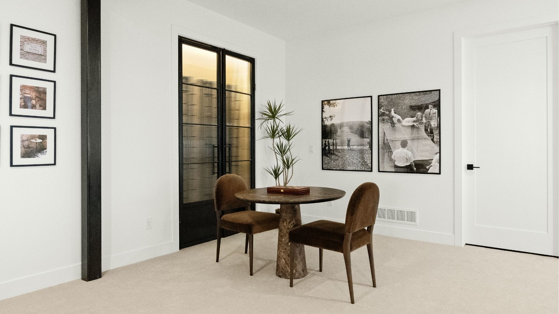 Basement game area with custom steel and glass wine display in Castle Rock luxury ranch