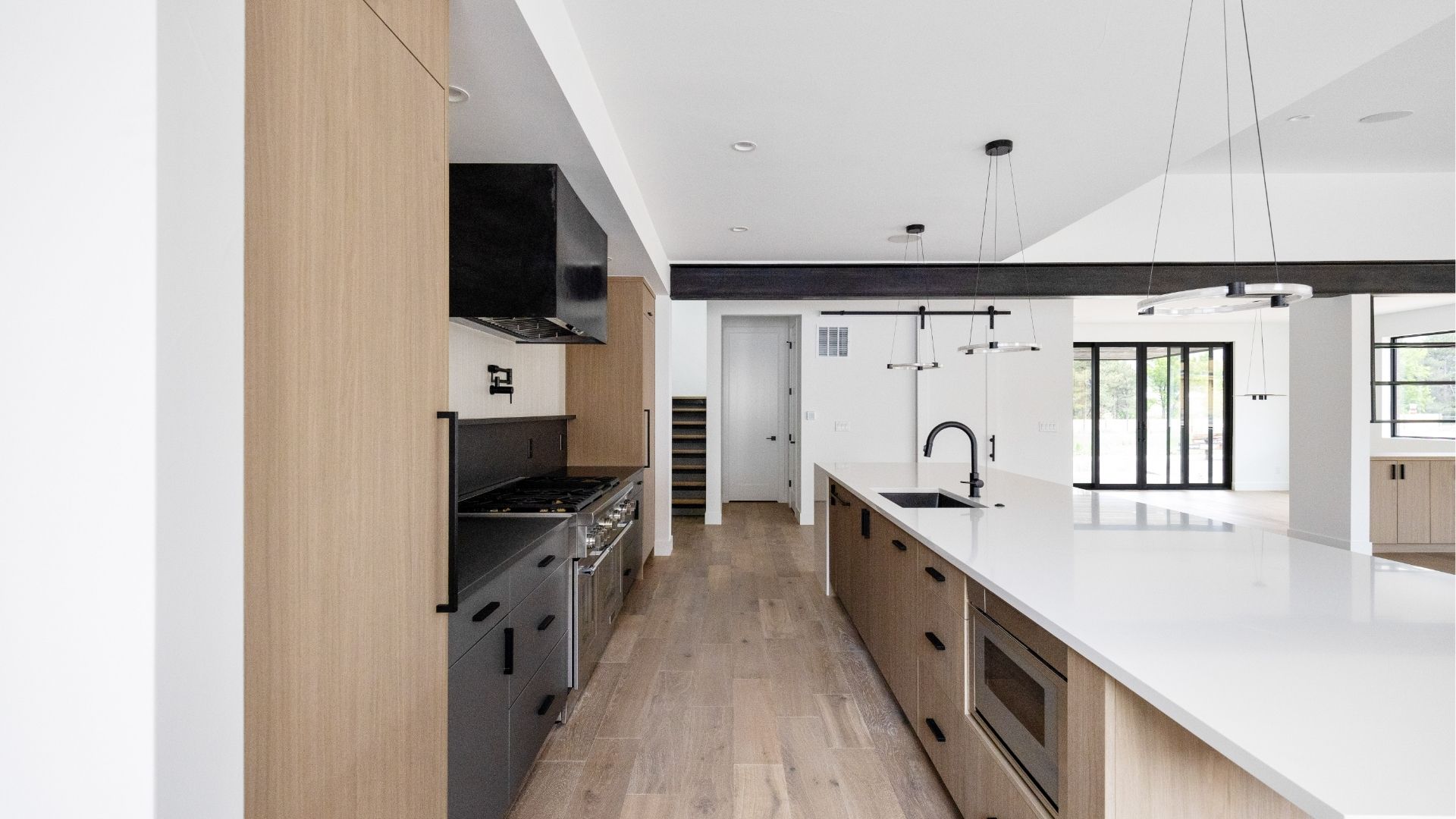 Chef-ready kitchen with professional appliances and custom iron beam detail in Golden luxury home