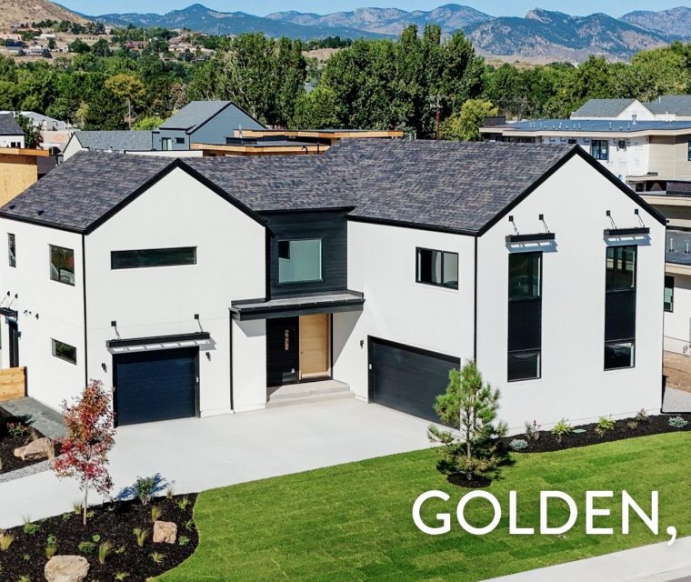 Contemporary luxury home exterior at 5031 Moss Place in Golden, CO featuring white stucco, black accents, and mountain views