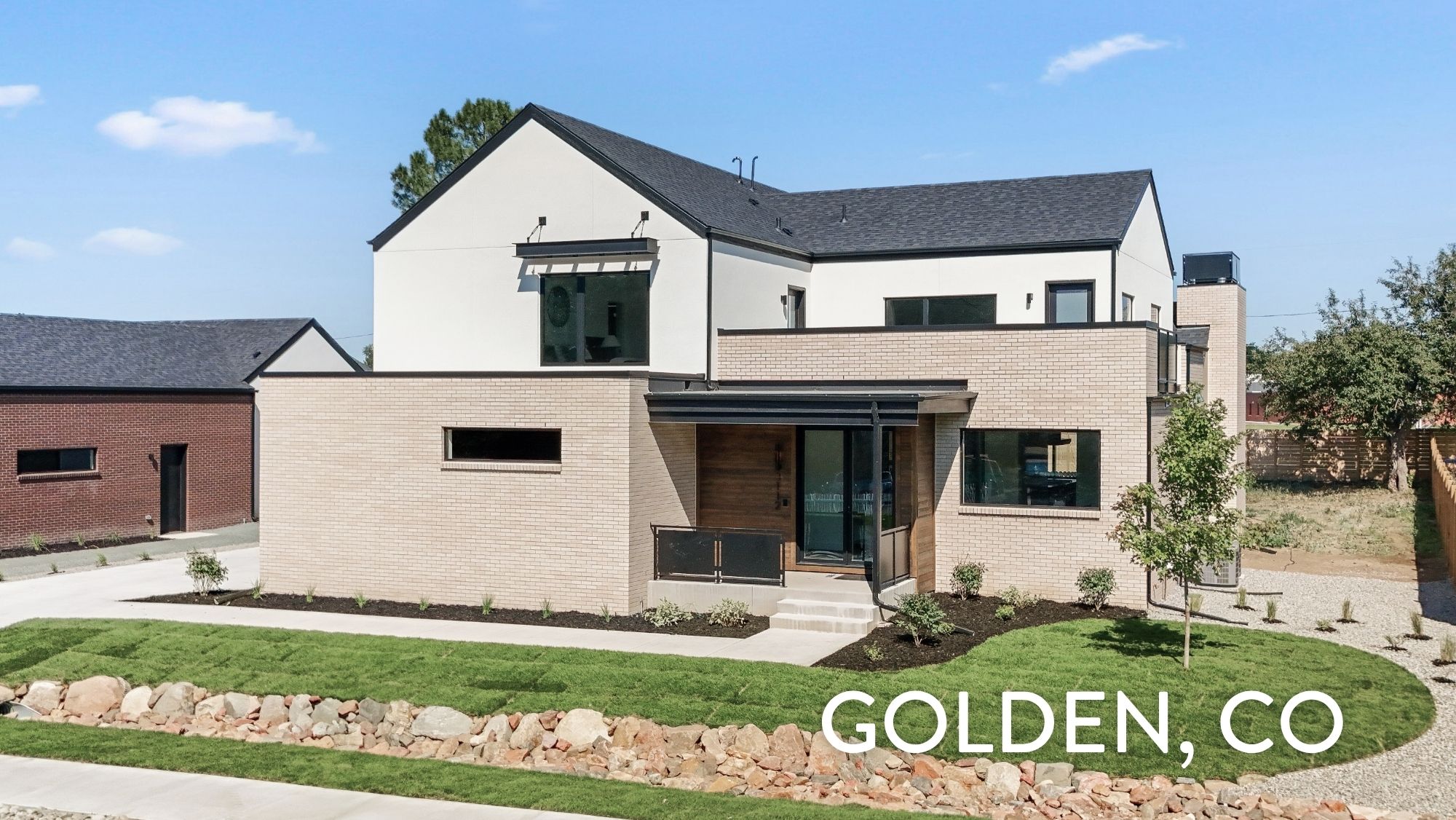 Modern luxury home exterior with mixed brick and stucco in Applewood West Golden Colorado