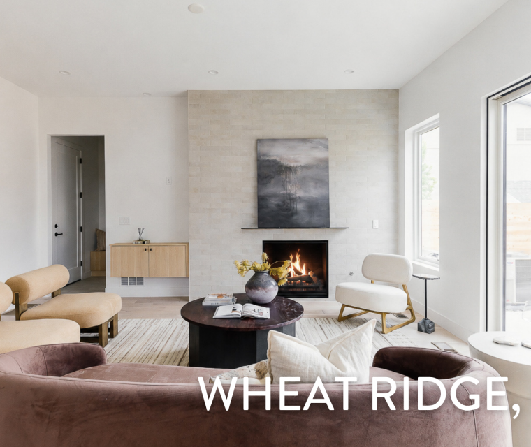 Modern living room with tile fireplace surround and large sliding glass doors in a luxury duplex at 3904 Upham St, Wheat Ridge, CO